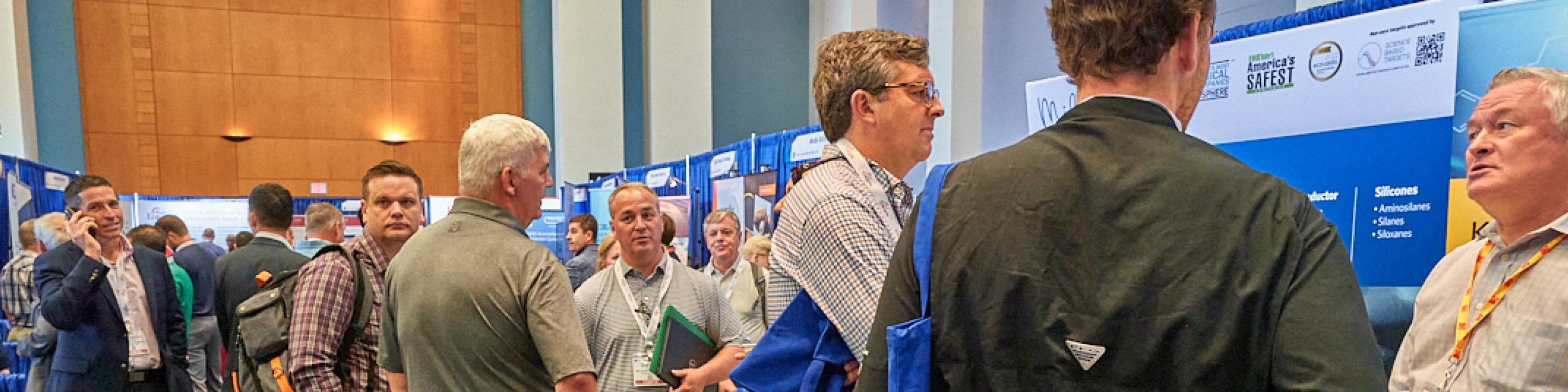 Representatives gather at booths to network